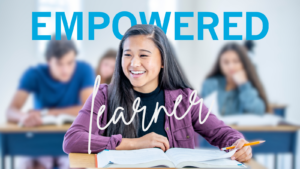 students sitting desks with the girl in foreground in sharp relief and the others are blurred.